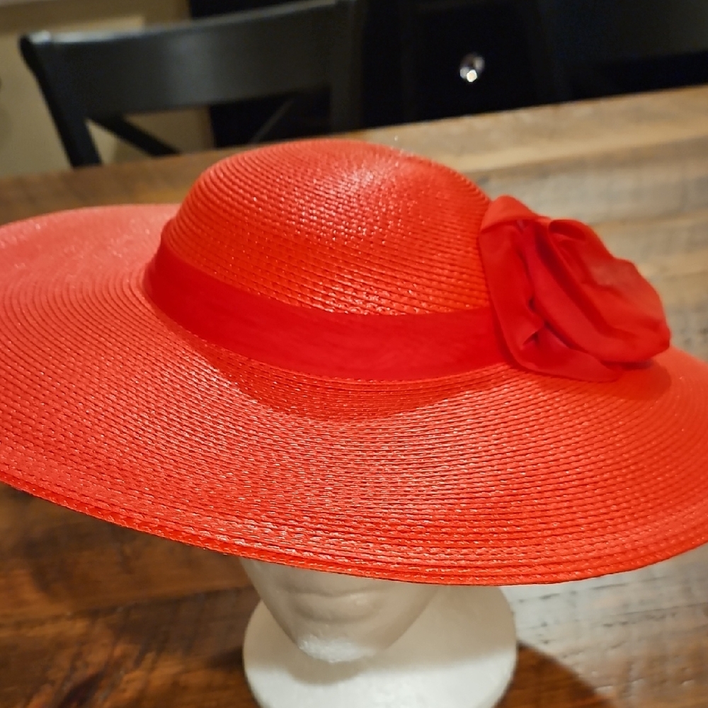GWEN PENNINGTON WIDE BRIM RED HAT WITH FLOWER.